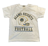 A white vintage short-sleeve t-shirt laid flat on a dark gray surface, featuring a distressed blue and yellow graphic that reads 'ALAMO HEIGHTS FOOTBALL' with a football helmet illustration.